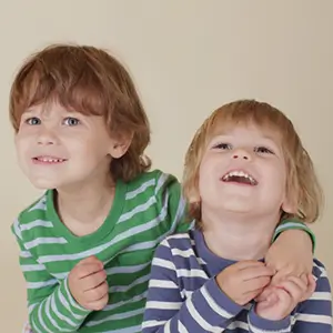 Two young children smiling