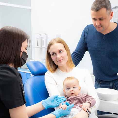 a family during their child’s dental appointment