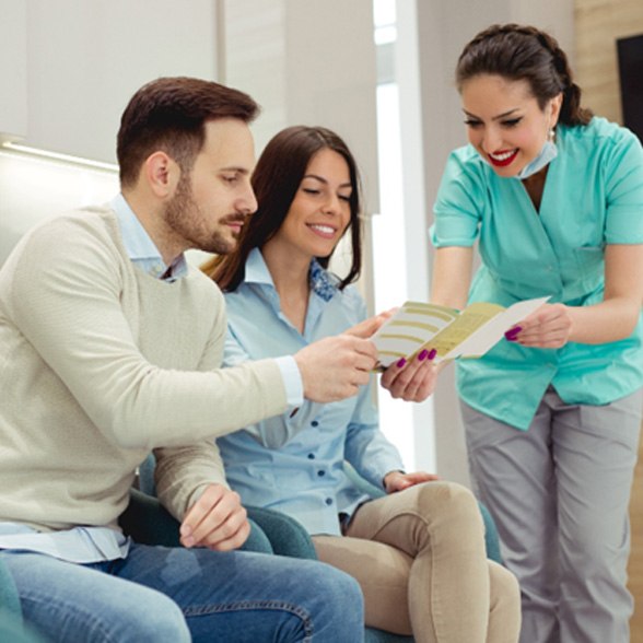 a couple reviewing their dental insurance benefits