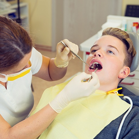 a teen visiting his dentist 