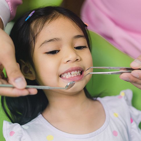 Little girl undergoing a dental checkup