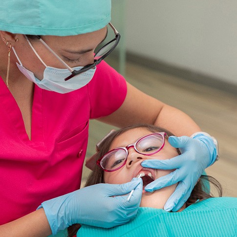 Young patient receiving fluoride treatment