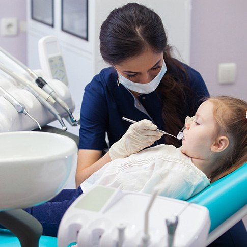 Young girl receiving a tooth-colored filling