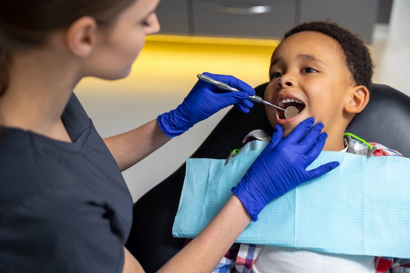 young boy receiving a dental checkup