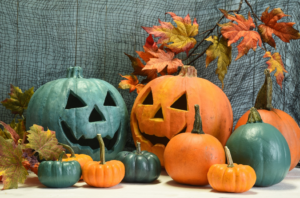 a group of orange and teal pumpkins